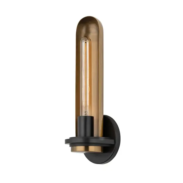 This theatrical-inspired wall sconce brings vintage drama to any space with its cylindrical glass shade plated in patina brass and soft black. The compact design casts a warm, reflective glow perfect for accent lighting.