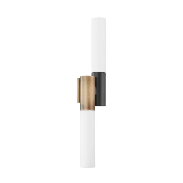 The Koa wall sconce by designer Zoe Mowat balances artistic form with practical function. Its sculptural placement of opal matte glass shades provides ambient light in multiple directions while the patina brass finish adds warmth and sophistication.
