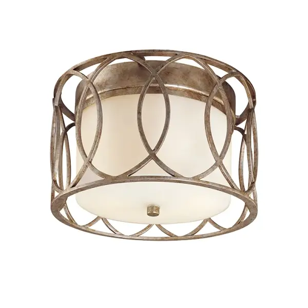 The Sausalito flush mount combines hand-worked iron in a distinctive Silver Gold finish with opal etched glass for soft, diffused light. Its compact 12.25-inch profile makes it ideal for spaces with standard ceiling heights.