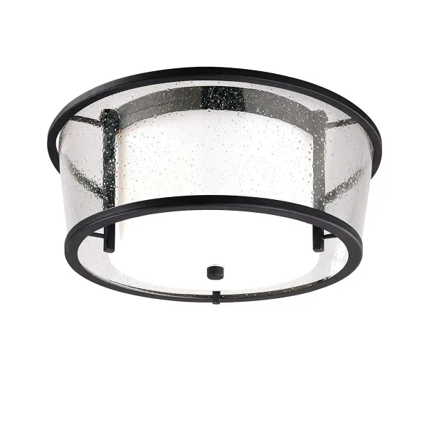 The Bennington combines hand-worked iron craftsmanship with clear seeded glass for an industrial-farmhouse aesthetic. Its compact 15-inch profile and damp rating make it ideal for covered outdoor spaces and transitional areas.