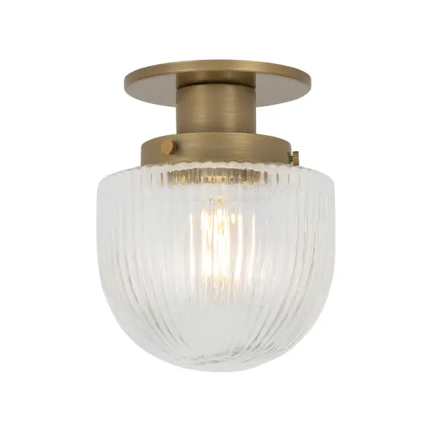 The Jar flush mount offers a stylish alternative to recessed lighting with its charming fluted glass shade and warm patina brass finish. Perfect for tight spaces where traditional fixtures won't fit, this petite downlight adds character without overwhelming.