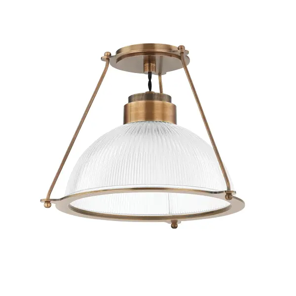 The Glint semi-flush mount brings retro RLM charm to low-ceiling spaces with its ribbed Holophane glass shade and clean structural frame. The patina brass finish adds warmth while the textured glass softly diffuses light for ambient illumination.