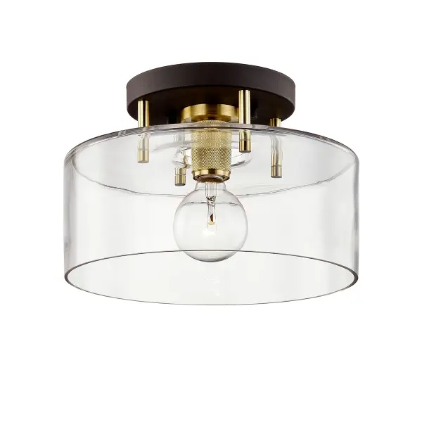 The Bergamot Station semi-flush mount combines industrial styling with artisanal metalwork. Its compact 12.25-inch profile and hand-worked iron construction make it ideal for spaces with lower ceilings or smaller footprints.