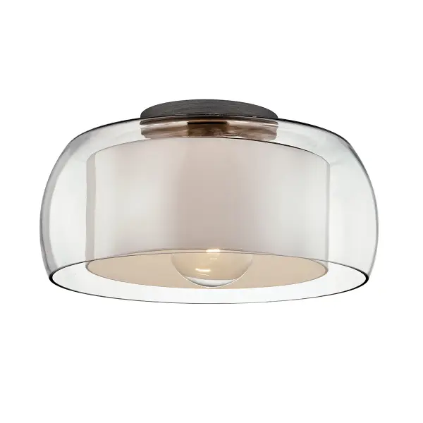 The Candace flush mount combines industrial style with refined craftsmanship. Hand-worked iron in graphite finish pairs with clear glass for a sophisticated look that works in both residential and commercial spaces.