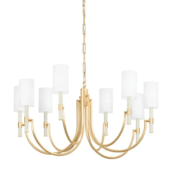 The Gustine chandelier combines graceful downward-sweeping arms with square metal accents and cream candle sleeves for timeless elegance. The Vintage Gold Leaf finish adds warmth and texture, making it versatile for traditional and transitional interiors.
