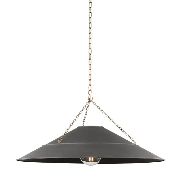 The Arcane pendant from Lauren Liess combines industrial edge with refined sophistication. Its graphite shade and patina brass hardware create a striking contrast, while twisted black fabric cord adds vintage charm.