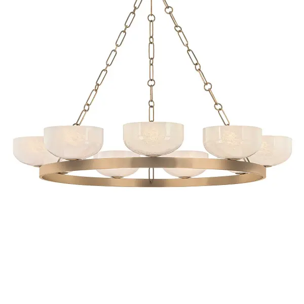 The Caelum transforms the classic ring chandelier with innovative details. Nine seeded cloud glass bowls cluster along the 44.5-inch frame for a luxurious, layered look. The elongated rod and hook suspension adds unexpected industrial charm to the warm patina brass finish.