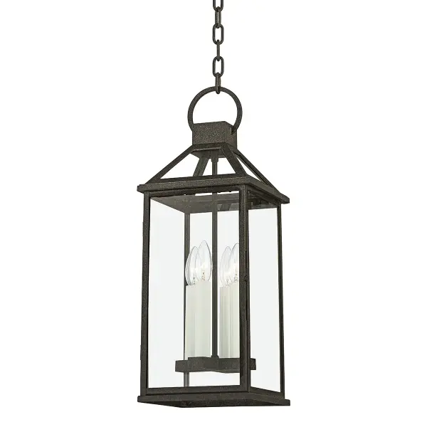 Designed by Becki Owens, this outdoor lantern brings cottage charm with clear glass panels and French Iron finish. The four-light configuration provides ample illumination while the wet-rated construction ensures durability in exposed locations.