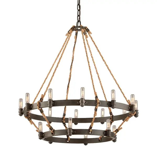 The Pike Place chandelier delivers dramatic illumination with 18 candelabra lights arranged in a 32-inch wide fixture. Its Heritage Bronze finish and solid aluminum construction offer durability with industrial-chic style.