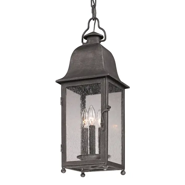 The Larchmont hanging lantern brings timeless appeal to covered outdoor spaces with hand-forged iron construction and clear seeded glass. Its compact 8-inch width makes it ideal for porches and entryways without overwhelming the space.