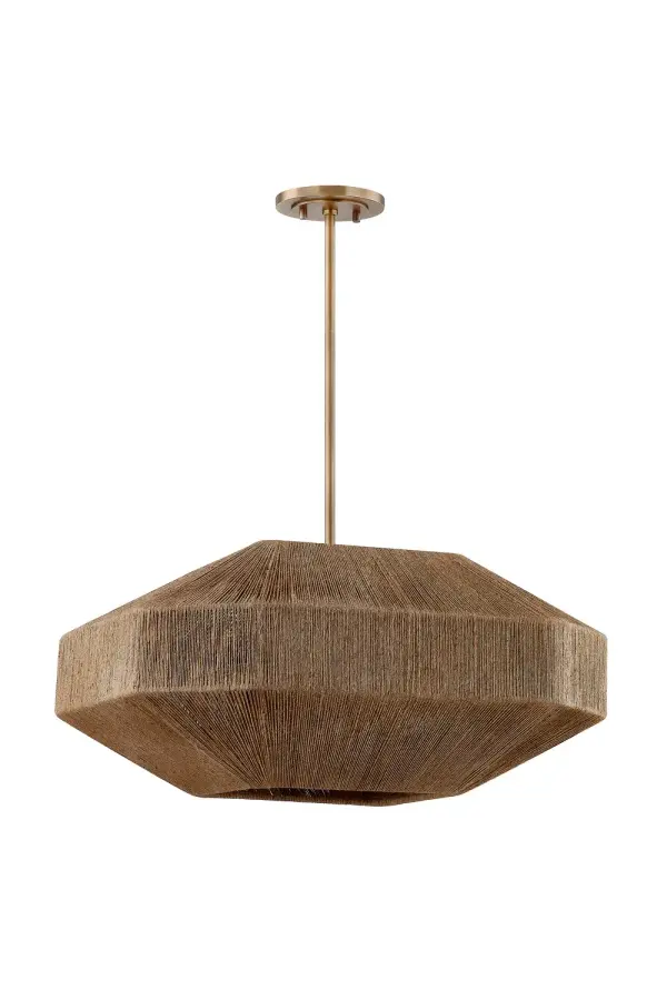 The Laken chandelier combines natural jute texture with antiqued brass metalwork for a sophisticated organic aesthetic. Its voluminous 24-inch shade creates dramatic impact while the four-light cluster provides ample illumination.