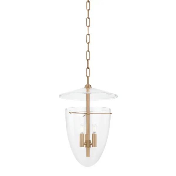 The Tully lantern offers a fresh take on traditional design with its all-glass bell jar construction and suspended disc detail. The patina brass finish adds warmth while the transparent design keeps sightlines open.