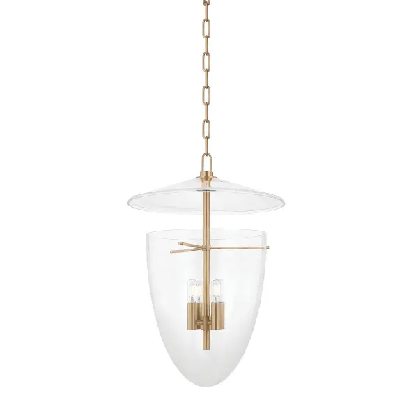 The Tully lantern reimagines traditional design with an all-glass composition featuring an inverted bell jar shape and suspended glass disc. Clean metalwork inside creates visual interest while the patina brass finish adds warmth.