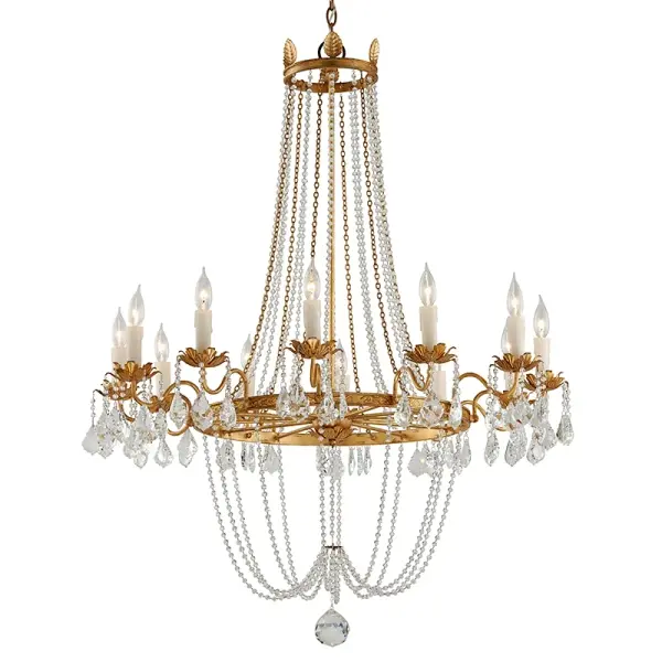 The Viola chandelier commands attention with its impressive 37.5-inch width and hand-worked iron construction finished in vintage gold leaf. Twelve candelabra lights provide abundant illumination, while clear glass shades add classic refinement.