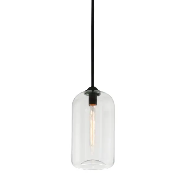 The District pendant brings refined industrial style to smaller spaces with its hand blown clear glass shade and soft black iron finish. The concave base detail creates ambient glow while the compact 8-inch width makes it ideal for multiples over islands or in tight spaces.