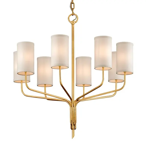 The Juniper chandelier combines hand-worked iron craftsmanship with sophisticated gold leaf finish and soft linen shades. Its generous 32-inch width and eight lights provide ample illumination while maintaining refined elegance.