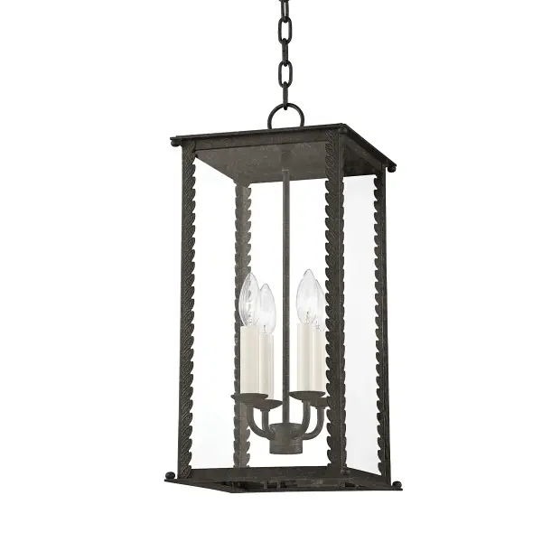 The Zuma outdoor lantern brings organic elegance to exterior spaces with its candelabra-style cage design and climbing leaf motifs. Clear glass panels showcase four candlestick lights while wet-rated construction ensures durability.
