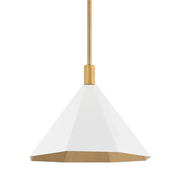 The Huntley pendant reimagines the classic cone shade with contemporary faceted geometry and a sophisticated two-tone finish. The Soft White exterior paired with Patina Brass interior creates beautiful warm ambient light.