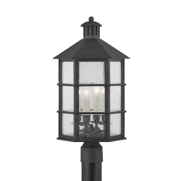Lake County by designer Mark D. Sikes blends modern nautical design with rustic and contemporary aesthetics. The matte black French Iron frame paired with seeded glass creates a soft, diffused glow perfect for outdoor spaces.
