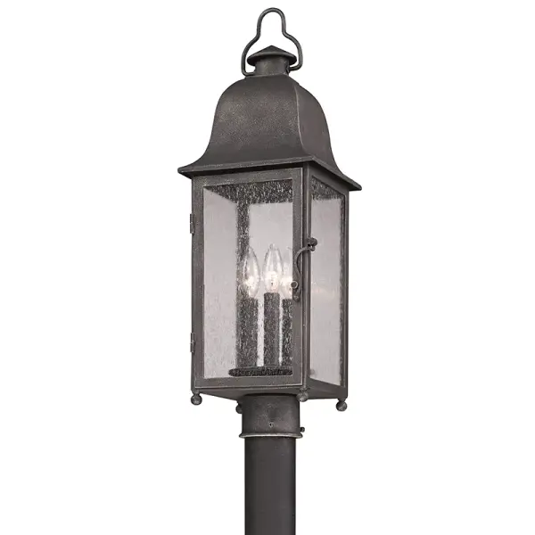 The Larchmont post lantern combines traditional design with hand-forged iron craftsmanship. Its vintage bronze finish and clear seeded glass create timeless curb appeal while the wet-rated construction ensures reliable outdoor performance.