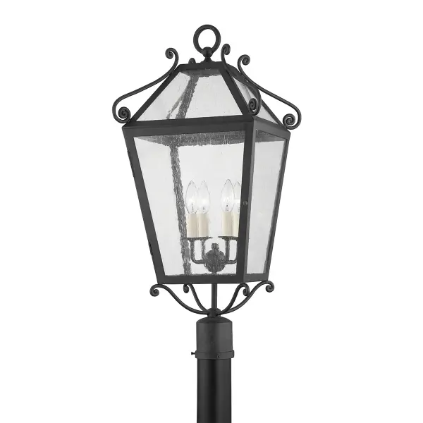 Designer Mark D. Sikes brings coastal sophistication with decorative scrollwork and dramatic scale. The wet-rated French Iron finish and clear glass shades deliver classic glamour perfect for covered outdoor areas.