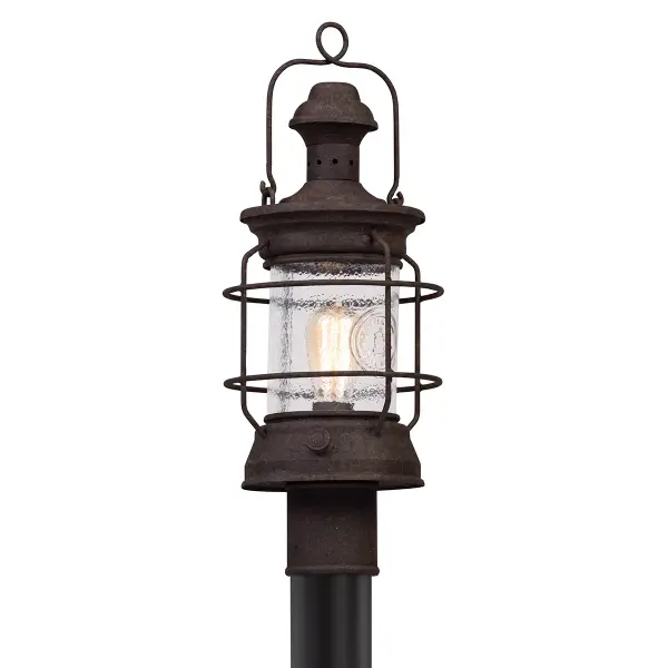 The Atkins Post Lantern combines traditional craftsmanship with durable outdoor construction. Hand-crafted iron and aluminum construction with clear glass panels delivers reliable illumination for pathways and entryways.