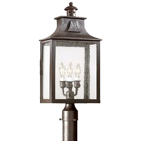The Newton post lantern combines traditional design with durable hand-forged iron construction. Its wet-rated design and clear glass panels make it ideal for exposed outdoor locations requiring reliable illumination.