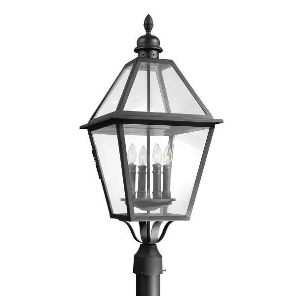 The Townsend post lantern combines traditional craftsmanship with durable outdoor construction. Hand-worked iron in textured black finish creates authentic character, while clear glass panels maximize light output for pathways and entryways.