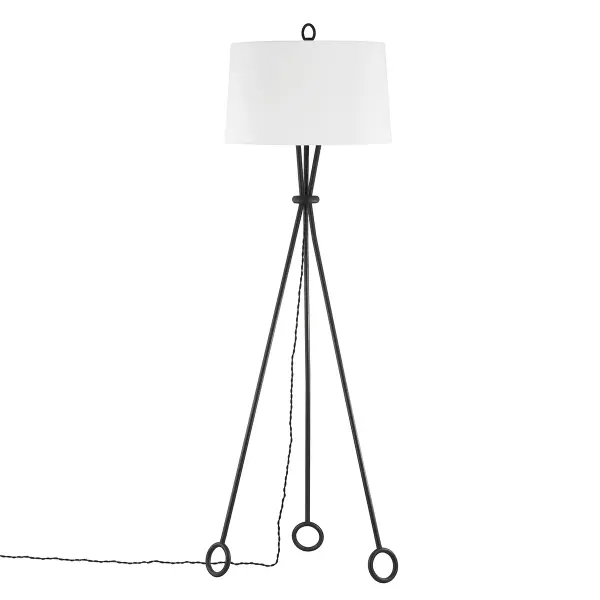 The Santa Monica floor lamp combines industrial metal rings with a refined white linen shade, creating an architectural statement piece. Its unique tripod base and hourglass form add visual interest while the forged iron finish brings warmth and character to modern spaces.