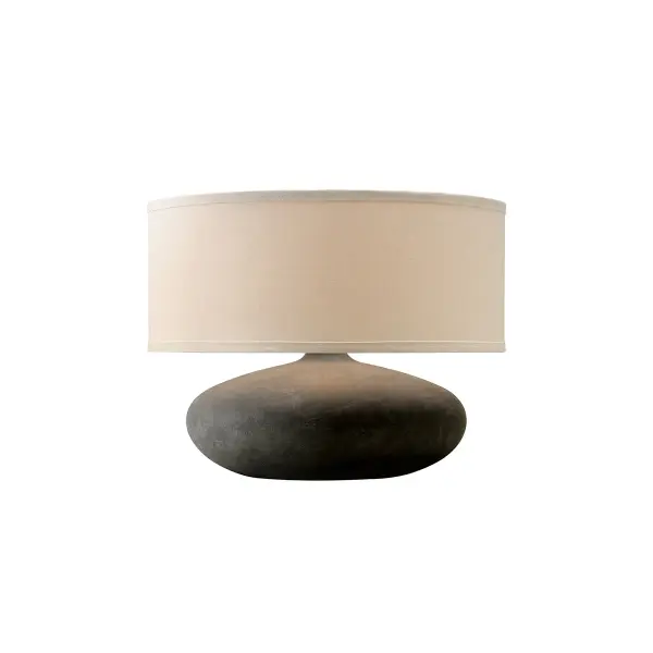 The Zen table lamp brings organic tranquility to modern interiors with its dimensional ceramic base and stone-inspired graystone finish. The natural linen drum shade softens light beautifully while complementing the earthy aesthetic.