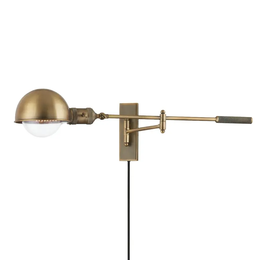 Cannon Adjustable Wall Sconce in Patina Brass