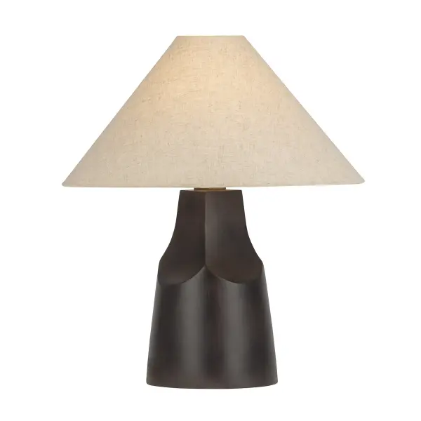 The Hewn table lamp brings organic warmth and handcrafted character to any space. Its hand-carved wood base features a distinctive split-log cutout detail, while the beige linen shade softens the light. Patina brass accents add refined contrast to the natural materials.