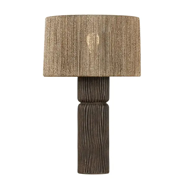 The Folk table lamp brings artisanal warmth through its textured ceramic base and handwoven abaca shade. Raked grooves create visual rhythm while Patina Brass hardware adds refined contrast. Perfect for spaces seeking natural, layered design.