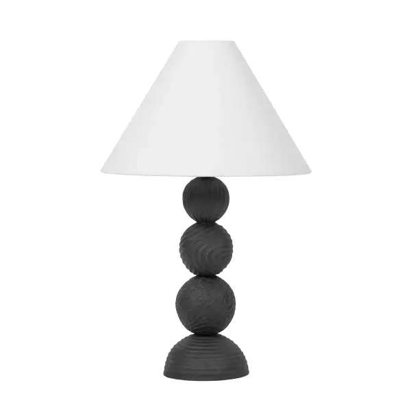 The Miela table lamp brings bold sculptural presence with its totem-style design featuring hand-crafted black ceramic spheres that evoke carved wood. The oversized pull chain and forged iron frame add industrial refinement.