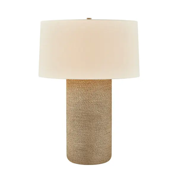 The Roan table lamp brings organic warmth indoors with its distinctive bleached jute rope-wrapped base. The natural fiber texture creates visual interest while the off-white linen shade softens the look. Patina brass accents add refined elegance.