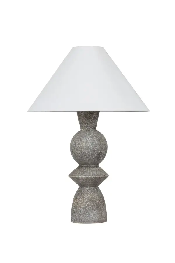 The Cyrah table lamp features a striking totemic design with stacked geometric shapes in lunar grey ceramic. Its matte, stone-like finish and artisanal quality create an earthy, sophisticated statement piece perfect for modern interiors.