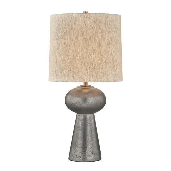 The McAlpine table lamp showcases exceptional artisanal craftsmanship with its hand-glazed ceramic base in Ancient Bronze. Each piece is unique with subtle variations in color and texture, paired with an elongated natural linen shade and refined Patina Brass accents.