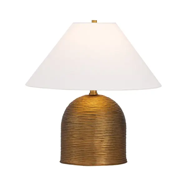 The Arvin table lamp brings organic texture and warmth through its ridged ceramic base that creates beautiful light and shadow play. The patina brass fittings and off-white linen shade complement coastal, transitional, and bohemian interiors perfectly.