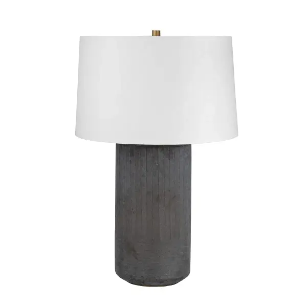 The Greyson table lamp combines minimalist design with traditional Indian cut glass craftsmanship. Its dark, faceted cylindrical glass base creates subtle texture and visual interest, while the oversized white linen shade provides soft, ambient lighting. A refined choice for contemporary and transitional interiors.