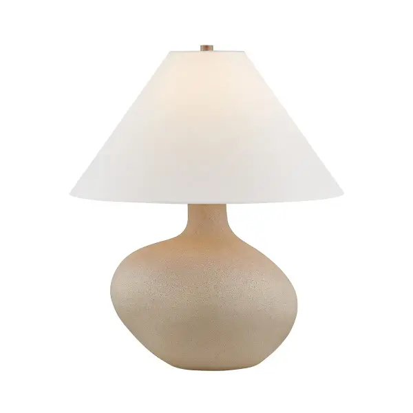 The Rebecca lamp celebrates imperfection with its asymmetrical ceramic base in chalky taupe glaze. Each piece is unique, featuring one shoulder rising higher than the other for visual interest from every angle. The sculptural form paired with a clean white linen shade creates a sophisticated statement piece that bridges traditional craftsmanship with contemporary design.