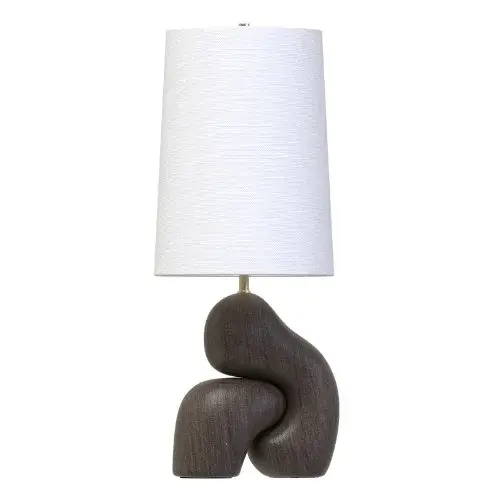 The Alyth table lamp transforms a 3-D scan of a Scots Pine sculpture into a striking lighting piece. Espresso wood interlocks in a dramatic gesture reminiscent of windswept Highland trees, complemented by patina brass accents and a textured linen shade.