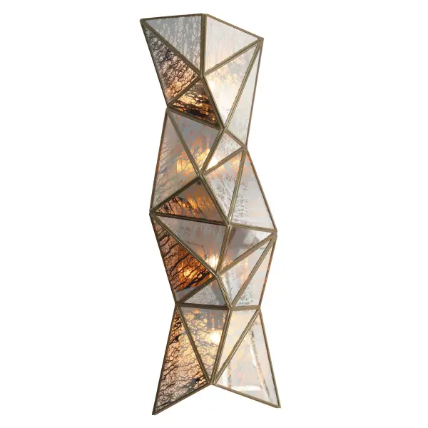 The Geo-Gem wall sconce combines contemporary geometric styling with Art Deco glamour. Four lights behind antique mercury glass panels create dramatic reflections, while the artisan brass finish adds warmth and sophistication.
