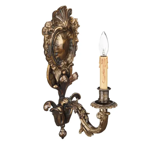This handcrafted Italian wall sconce brings Old World craftsmanship to modern interiors. The oxide brass finish offers rich, warm tones that complement traditional and transitional spaces with authentic European styling.