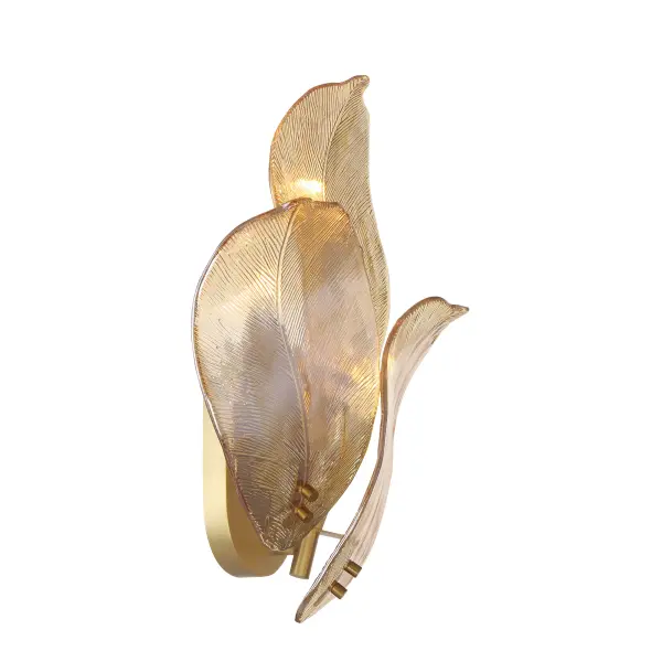 The Orchid wall sconce combines classic brass craftsmanship with handmade amber glass for a sophisticated, warm glow. Its 18-inch height and three-light design make it ideal for flanking mirrors, artwork, or creating ambient lighting. - alternate view