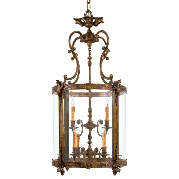 This impressive 9-light foyer pendant showcases authentic Italian craftsmanship using the traditional lost wax casting technique. The substantial 25-inch width and antique bronze patina finish create a commanding presence perfect for grand entryways and two-story spaces.