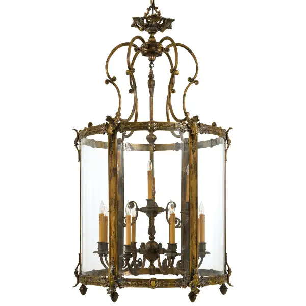 This handcrafted Italian foyer pendant commands attention with 12 lights and a substantial 33.75-inch width. The Oxide Brass finish and clear glass create timeless elegance perfect for grand entryways and formal spaces.