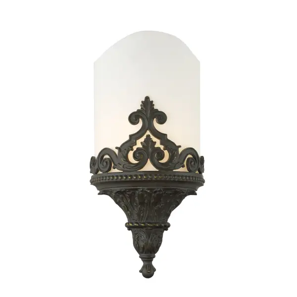 This Metropolitan wall sconce combines timeless design with practical functionality. The aged bronze finish and white faux alabaster shade create a warm, inviting ambiance perfect for traditional and transitional interiors.