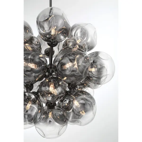 The Neveh pendant makes a bold architectural statement with 25 candelabra bulbs arranged in a striking geometric composition. Gun metal finish and smoke grey glass create sophisticated contrast perfect for contemporary spaces. - alternate view
