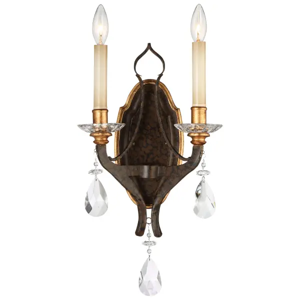 The Chateau Nobles wall sconce combines Old World elegance with transitional versatility. Its raven bronze finish with sunburst gold leaf highlights creates dramatic visual interest, while dual candelabra bulbs provide warm ambient lighting.
