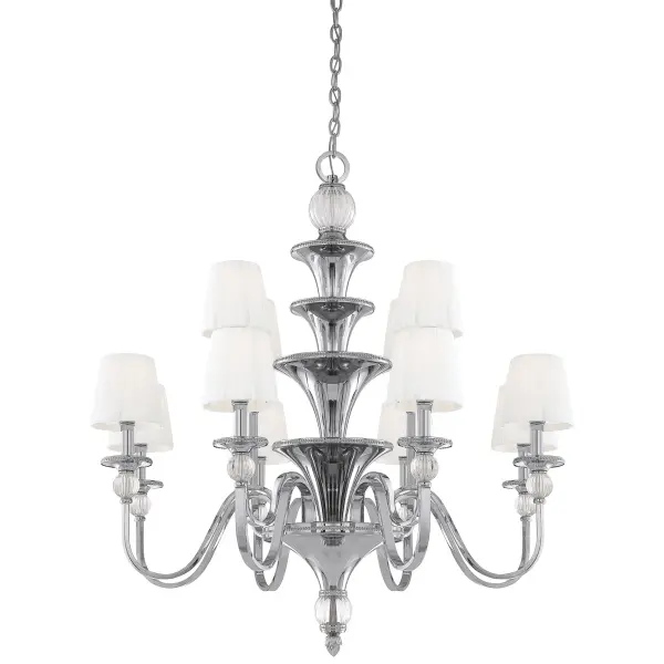 The Aise chandelier combines polished nickel metalwork with ribbed optic glass accents and white pleated fabric shades for a refined transitional aesthetic. Its 12-light configuration and two-tier design provide substantial illumination.